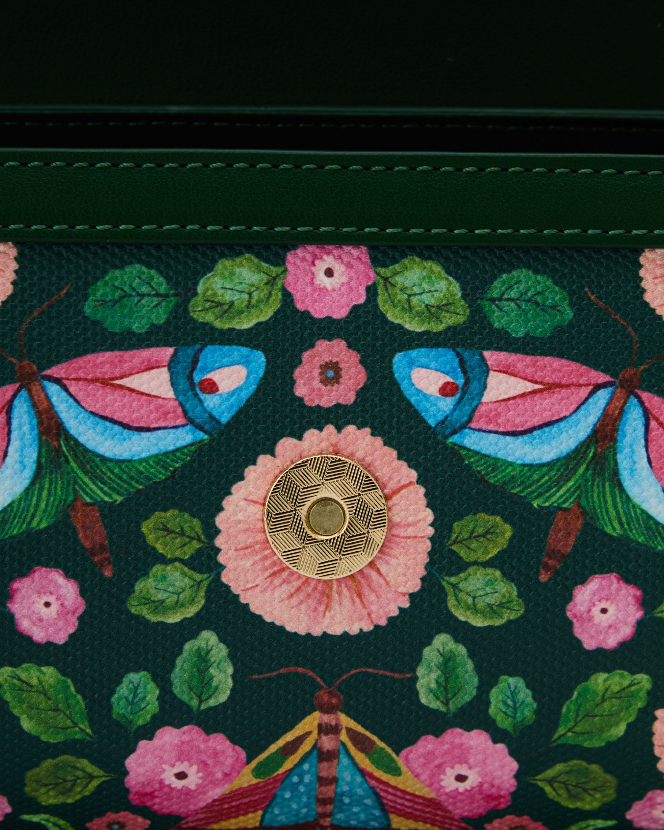 Close-up of hand-painted butterfly artwork on Flutter Clutch Bag by House of Kiyaara, showing original brushwork detail from the Farasha collection on vegan leather surface